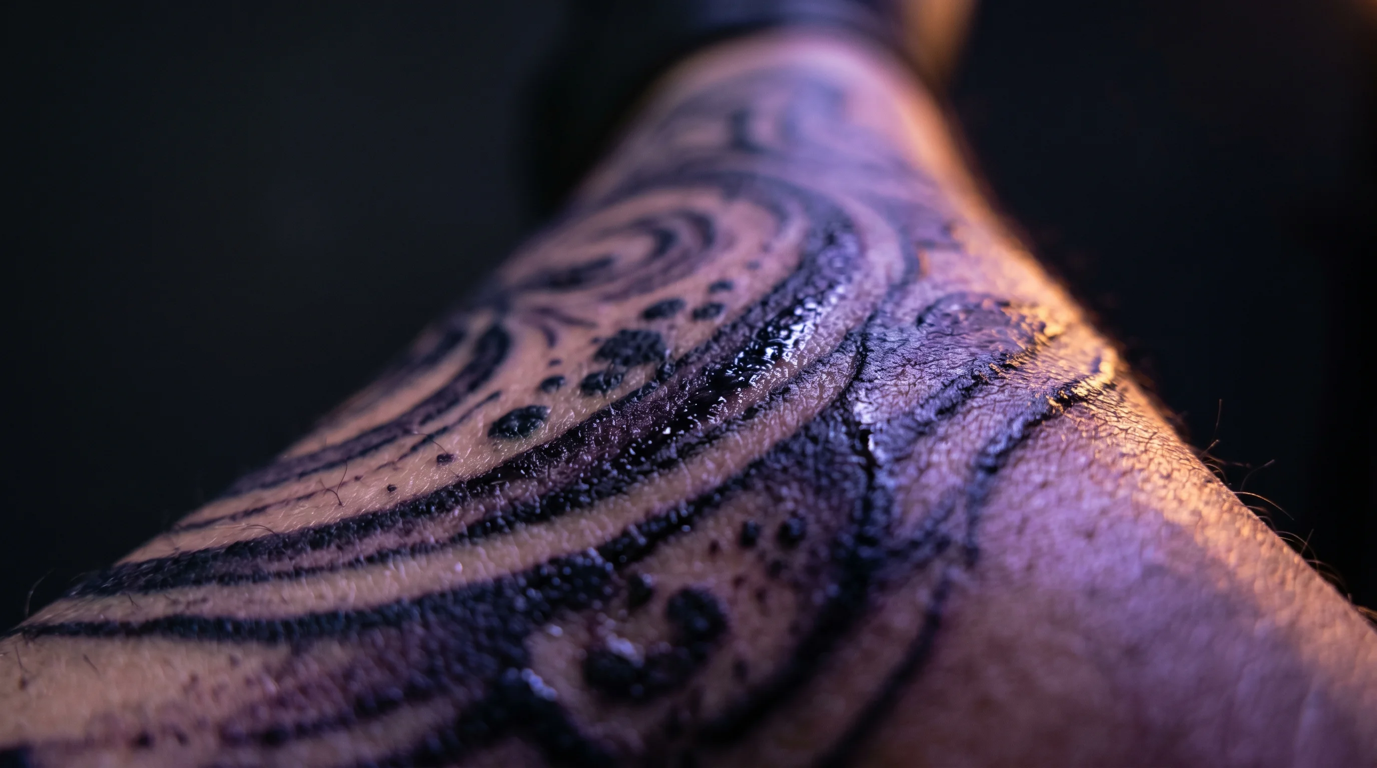Dramatic close-up of dark tattoo ink on skin, cinematic lighting, dark background
